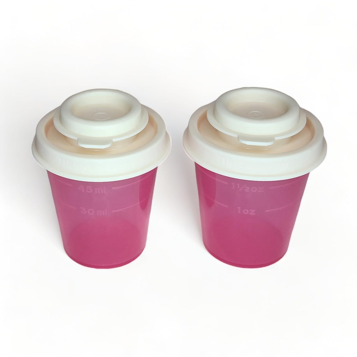 Tupperware Mini Salt and Pepper Shakers 2 oz Pink with Cream Lids