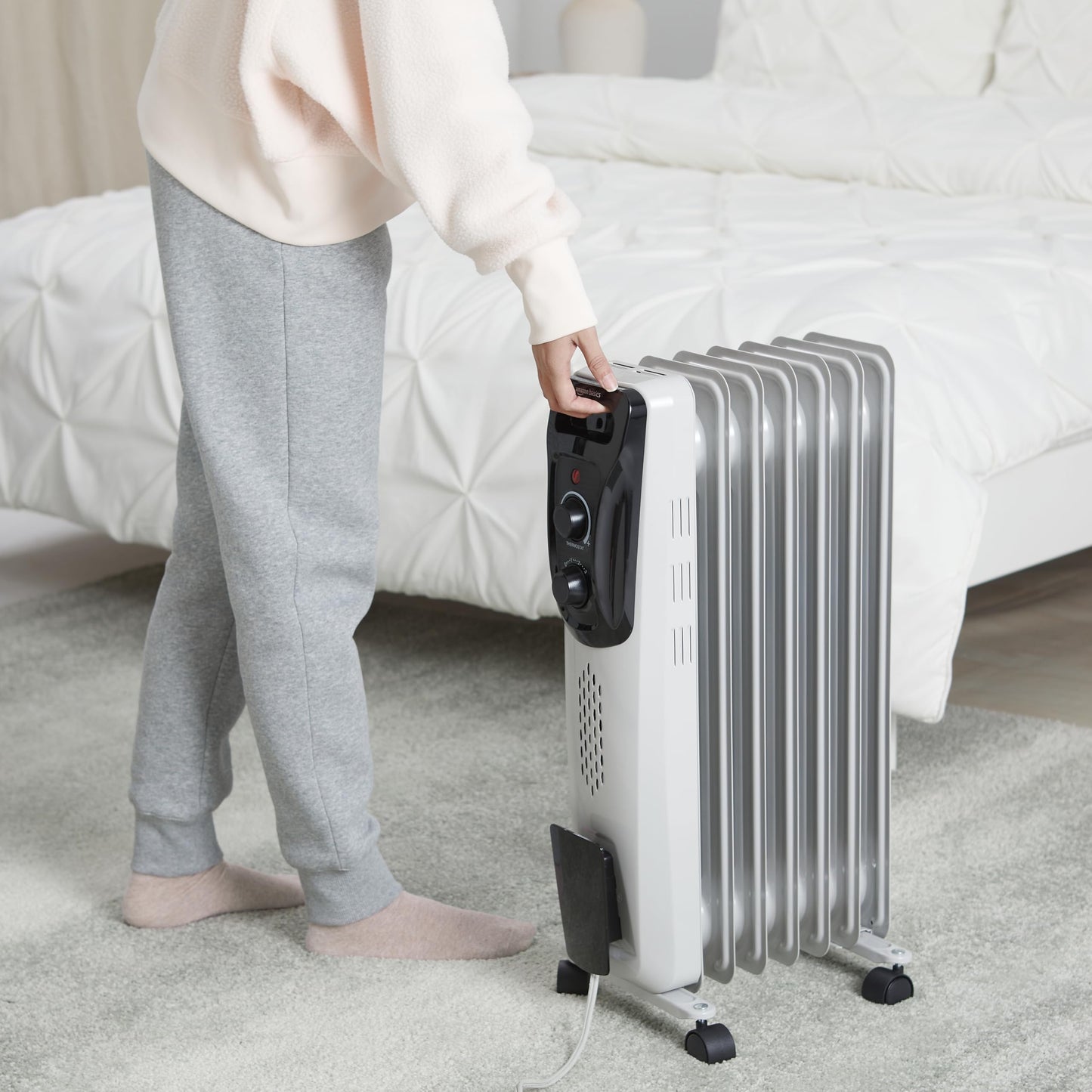 Amazon Basics Portable Oil Radiator Heater, Indoor Use, 3 Heat Settings, Over-Heat Protection, ETL-certified Safety, 7 Oil-Filled Steel Fins, 1500W, Tip-Over Protection, 11"D x 14.8"W x 25.2"H, White