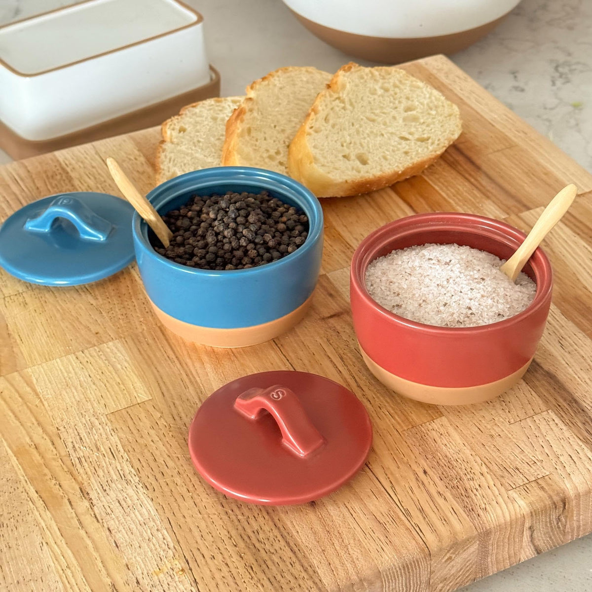 Mora Ceramic Salt and Pepper Cellar Set with Lid - 10 oz Modern Canister/Container/Bowl for Storage, Sea Salt, Spice, Sugar, Countertop - Small Dish/Jar with Wood Spoon, Azure Blue & Crimson Red Crock
